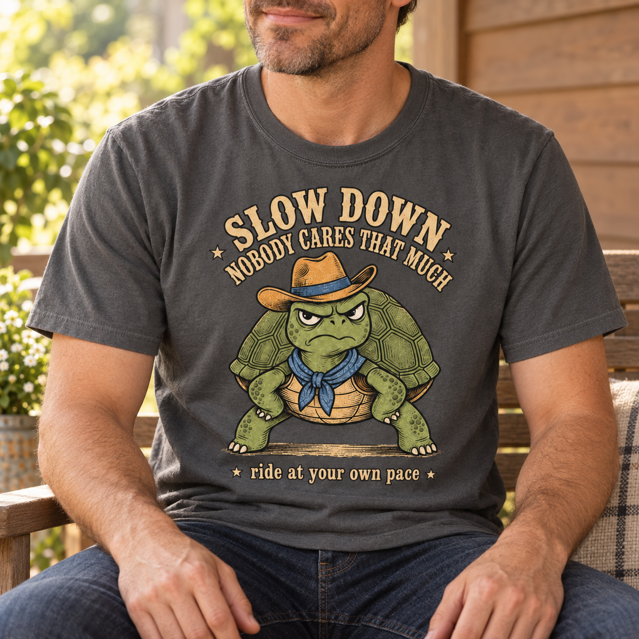 Man wearing the Slow Down Nobody Cares That Much turtle tee