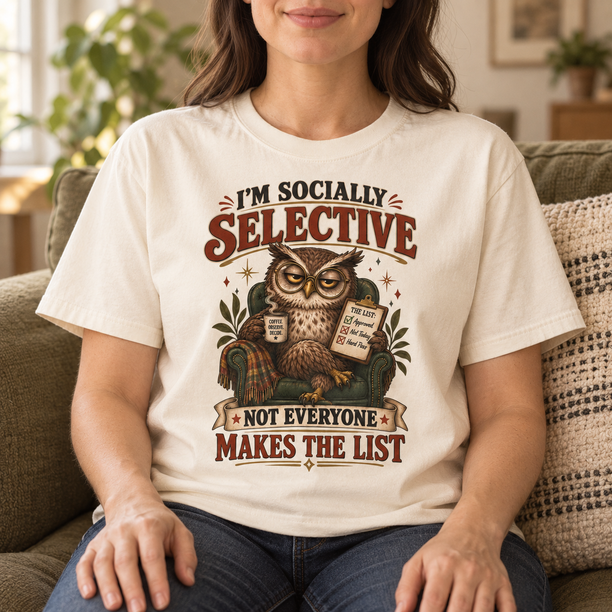 Woman wearing the Socially Selective owl tee at home
