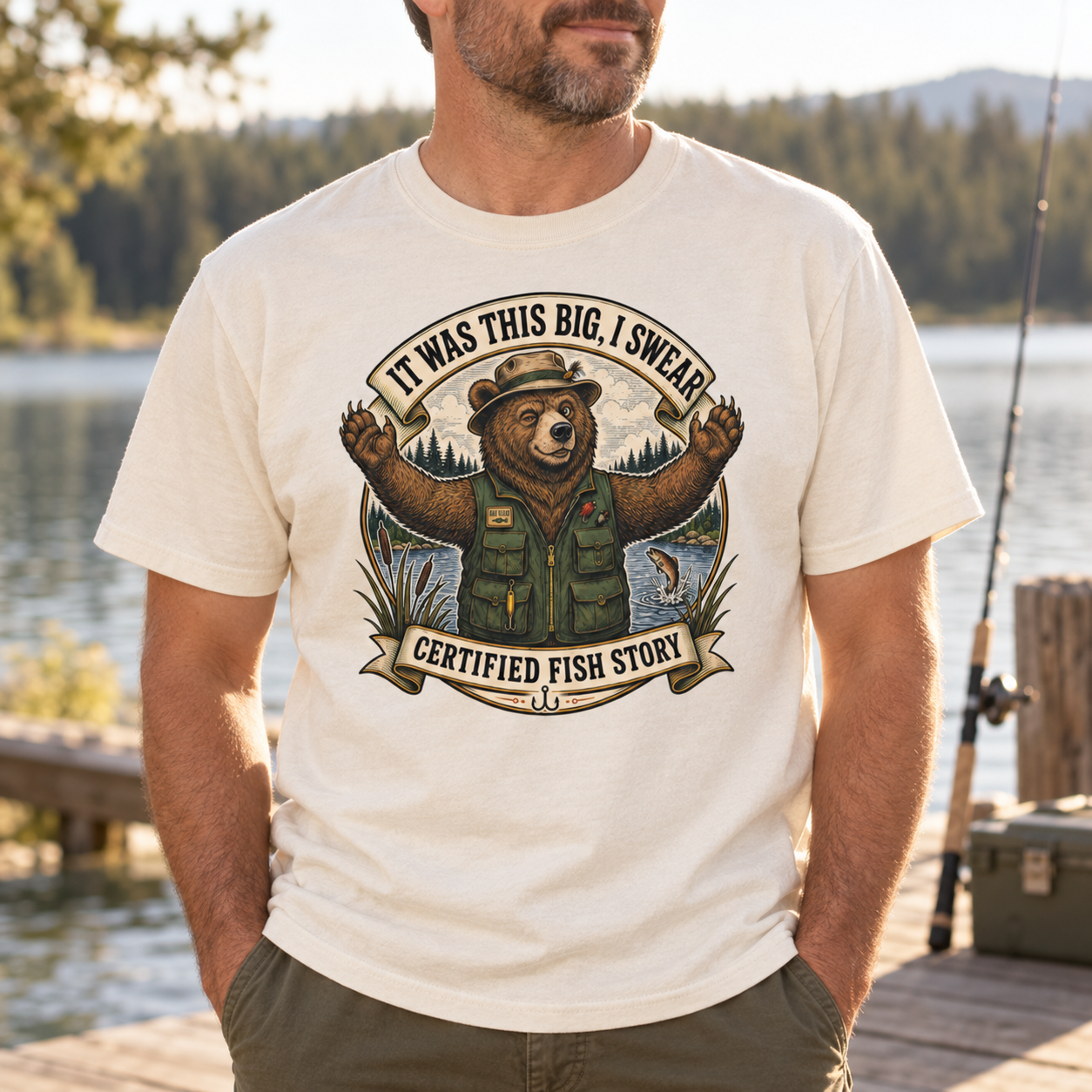 Man wearing the It Was This Big I Swear fishing tee beside a lake